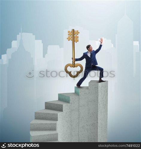 The businessman with key to success at the top of career. Businessman with key to success at the top of career