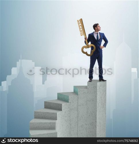 The businessman with key to success at the top of career. Businessman with key to success at the top of career