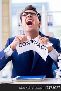 The businessman with message in the office at desk. Businessman with message in the office at desk