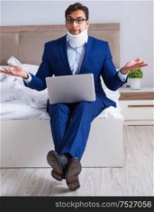 The businessman with neck injury working from home. Businessman with neck injury working from home