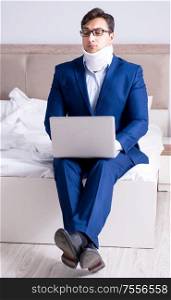 The businessman with neck injury working from home. Businessman with neck injury working from home