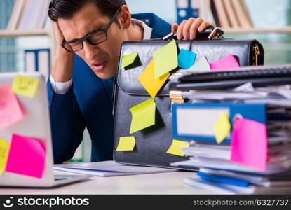 The businessman with reminder notes in multitasking concept. Businessman with reminder notes in multitasking concept