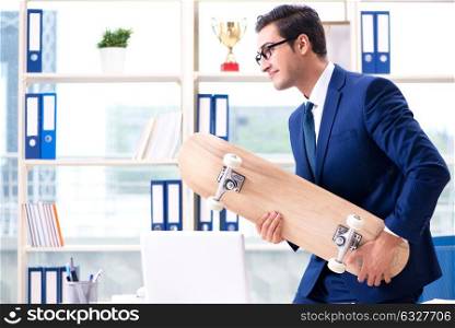 The businessman with skateboard in office. Businessman with skateboard in office