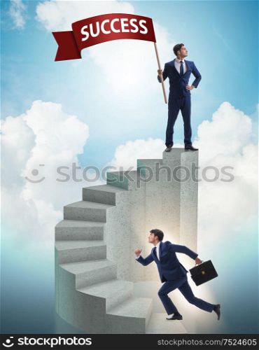 The businessman with success banner in business concept. Businessman with success banner in business concept