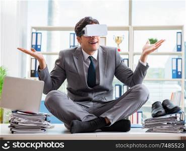 The businessman with vr virtual reality glasses in office. Businessman with VR virtual reality glasses in office