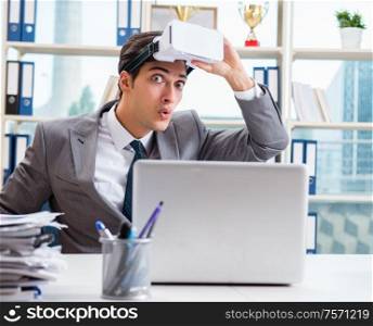 The businessman with vr virtual reality glasses in office. Businessman with VR virtual reality glasses in office