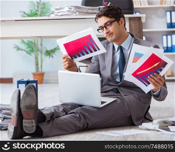 The businessman working and sitting on floor in office. Businessman working and sitting on floor in office