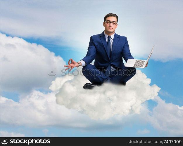 The businessman working on laptop in the sky. Businessman working on laptop in the sky