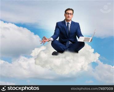 The businessman working on laptop in the sky. Businessman working on laptop in the sky