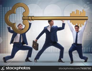 The businessmen holding giant key in business concept. Businessmen holding giant key in business concept