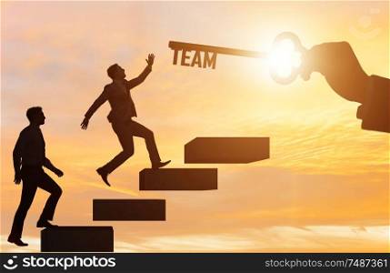 The businessmen on career ladder in teamwork concept. Businessmen on career ladder in teamwork concept