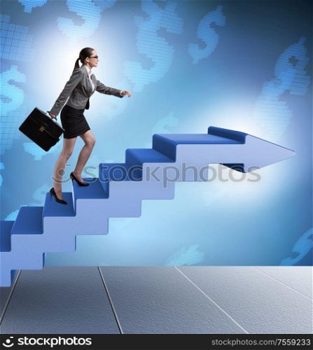 The businesswoman climbing career ladder in business concept. Businesswoman climbing career ladder in business concept