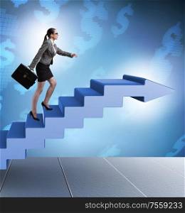 The businesswoman climbing career ladder in business concept. Businesswoman climbing career ladder in business concept