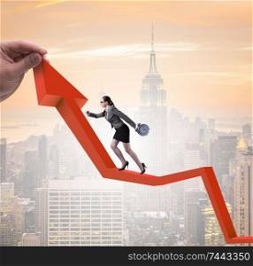 The businesswoman climbing line chart in economic recovery concept. Businesswoman climbing line chart in economic recovery concept