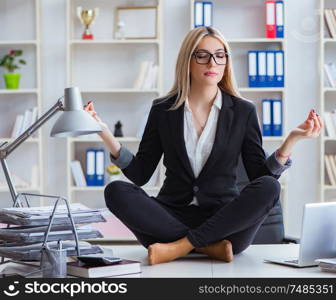 The businesswoman frustrated meditating in the office. Businesswoman frustrated meditating in the office