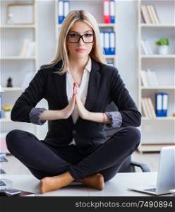 The businesswoman frustrated meditating in the office. Businesswoman frustrated meditating in the office
