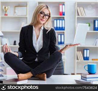 The businesswoman frustrated meditating in the office. Businesswoman frustrated meditating in the office