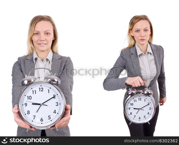 The businesswoman in gray suit holding alarm clock isolated on white. Businesswoman in gray suit holding alarm clock isolated on white