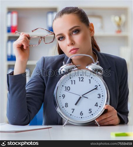 The businesswoman in time management concept. Businesswoman in time management concept