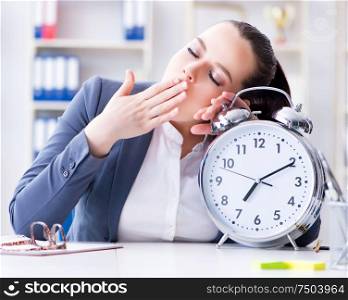 The businesswoman in time management concept sleeping. Businesswoman in time management concept sleeping