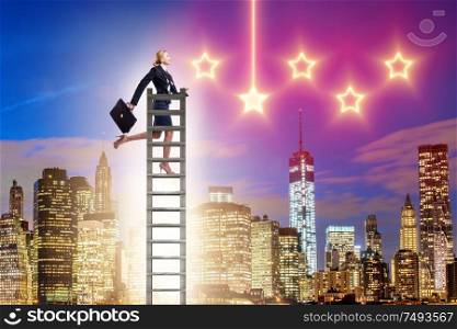 The businesswoman reaching out for stars in success concept. Businesswoman reaching out for stars in success concept