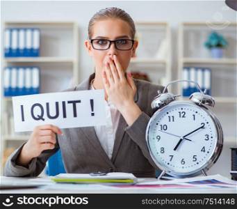 The businesswoman sitting in office with message. Businesswoman sitting in office with message
