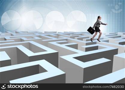 The businesswoman trying to escape from maze. Businesswoman trying to escape from maze