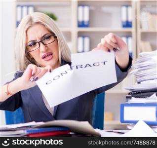 The businesswoman with message in office at desk. Businesswoman with message in office at desk