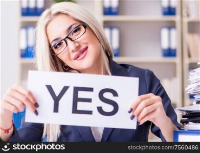 The businesswoman with message in office at desk. Businesswoman with message in office at desk