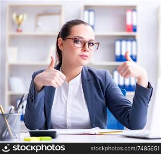 The businesswoman working in the office at desk. Businesswoman working in the office at desk