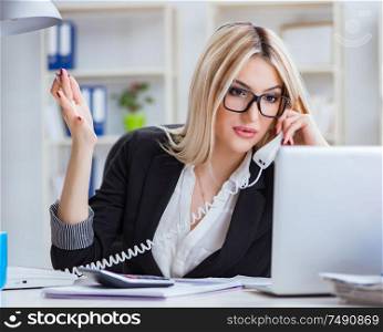 The busineswoman frustrated working in the office. Busineswoman frustrated working in the office
