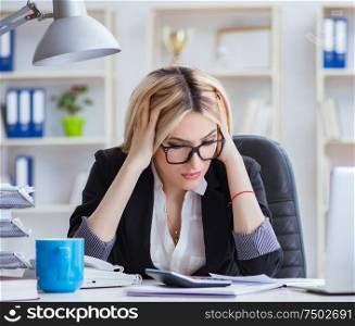 The busineswoman frustrated working in the office. Busineswoman frustrated working in the office