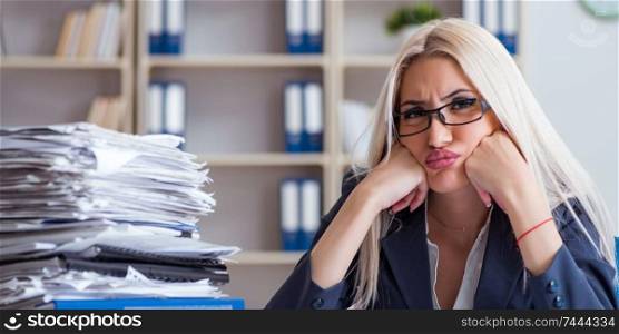 The busy businesswoman working in office at desk. Busy businesswoman working in office at desk