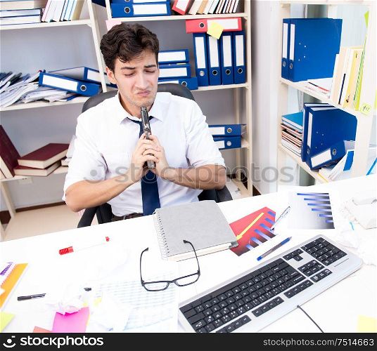 The busy frustrated businessman angry in the office. Busy frustrated businessman angry in the office