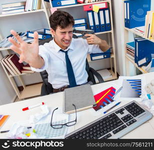 The busy frustrated businessman angry in the office. Busy frustrated businessman angry in the office