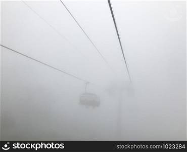 The cable car in fog. Caucasus mountains. Sochi area, Russia