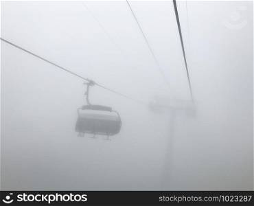 The cable car in fog. Caucasus mountains. Sochi area, Russia