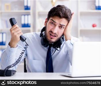 The call center employee working in office. Call center employee working in office