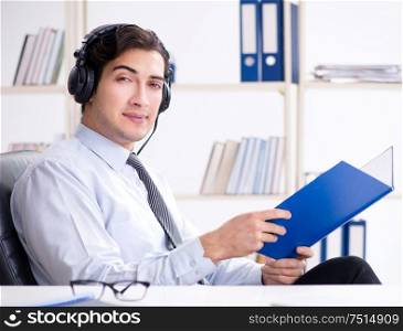 The call center operator talking to customer on live call. Call center operator talking to customer on live call