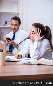 The call center operators working in the office. Call center operators working in the office