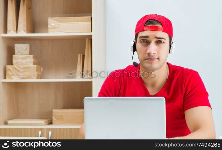 The call center worker at parcel distribution center in post office. Call center worker at parcel distribution center in post office