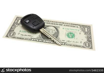 The car key lies on a dollar denomination isolated on white in a background