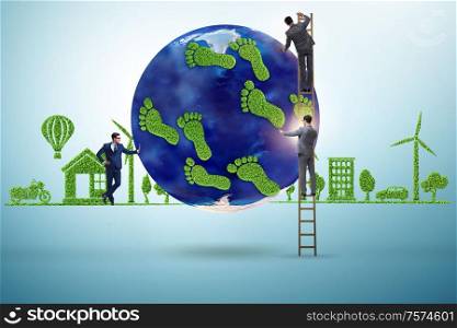 The carbon footprint concept with businessman. Carbon footprint concept with businessman