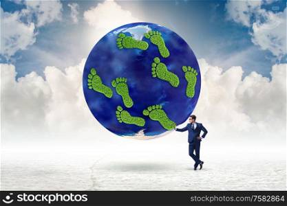 The carbon footprint concept with businessman. Carbon footprint concept with businessman