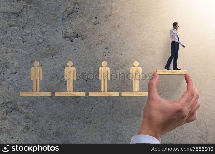 The career ladder concept with businessman. Career ladder concept with businessman