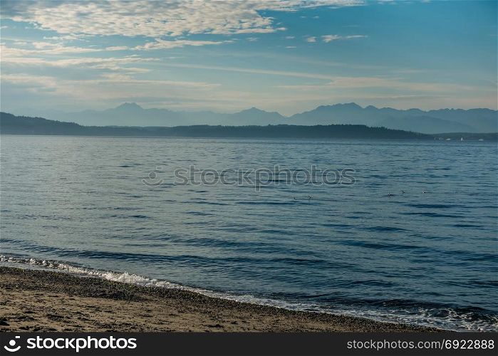 The Cascade Mountains as seen from Alki Beach in West Seattle.