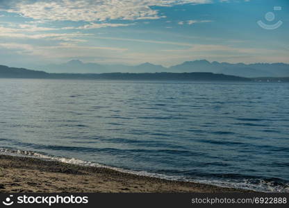 The Cascade Mountains as seen from Alki Beach in West Seattle.