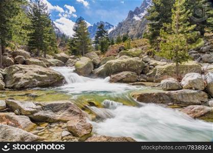 The cascades, waterfalls and snow capped mountains at Restonica valley near Corte in Corsica