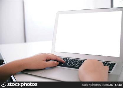 The Casual business woman works online on laptop which hand on keyboard in her house Isolated screen