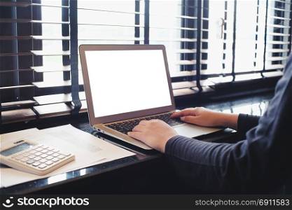 The Casual business woman works online on laptop which hand on keyboard in her house Isolated screen in laptop (blank white screen).